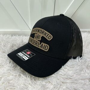 Overworked and underlaid. Trucker Richardson 112 hat.